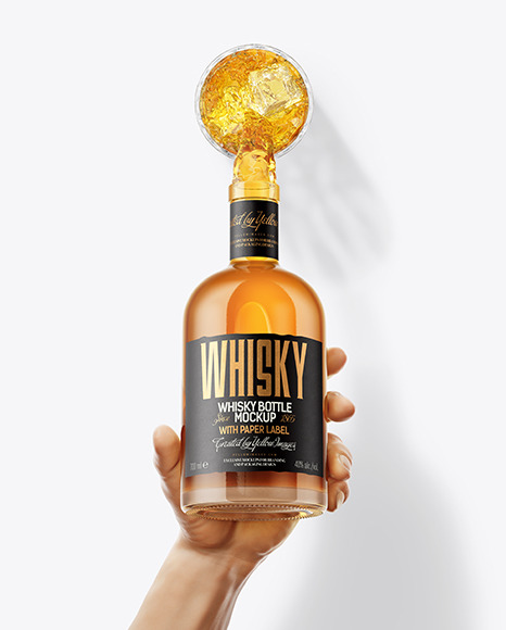 Whisky Bottle in a Hand Mockup